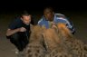 <p>Balázs Buzás and Mulugeta feed wild Spotted Hyenas (<em>Crouta crocuta</em>) near the Fallana Gate in Harar, ETHIOPIA</p>